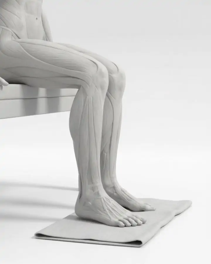 A foot on a towel, toes curled to scrunch the towel, the intrinsic foot muscles highlighted